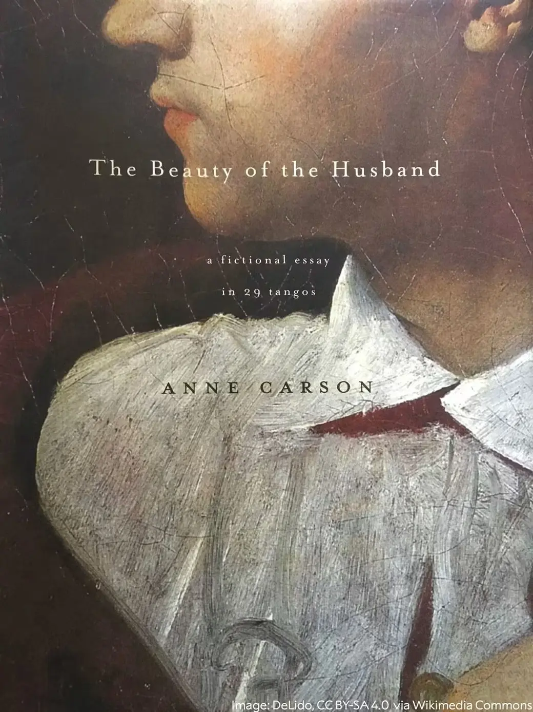 《The Beauty of the Husband》2001 年初版書衣的照片。整面是一幅帶龜裂紋的老油畫局部：一個人朝左的側臉，只露出鼻尖、嘴唇與下巴，深紅色外衣，白色大翻領佔滿畫面下半部。書名、副標「a fictional essay in 29 tangos」與作者名 ANNE CARSON 印在畫面中央。
