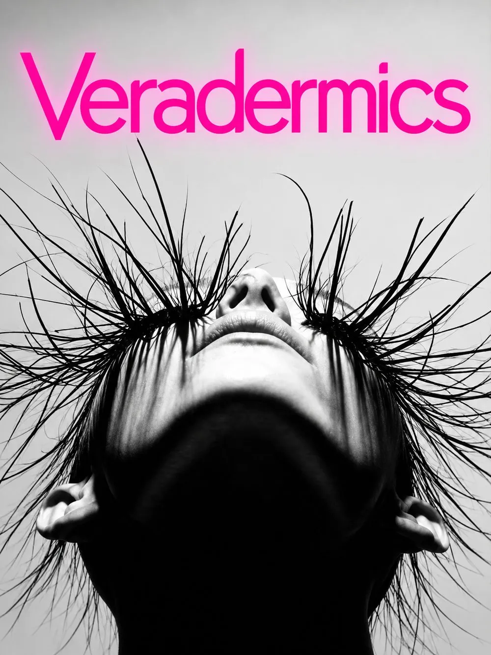 Veradermics 公司的品牌形象照。黑白影像，一位人物仰頭向上，長髮向四周散開成放射狀，畫面上方是桃紅色的公司名稱 Veradermics。